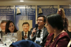 A member of the audience asking questions to the panel
