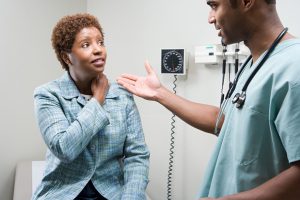 Female Patient and Male Nurse discuss