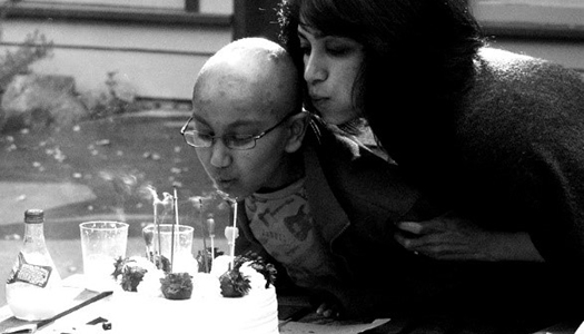 Faces and Voices of Cancer Story: Amaey Shah & childhood leukemia Purvi and Amaey Shah blow out candles on a birthday cake