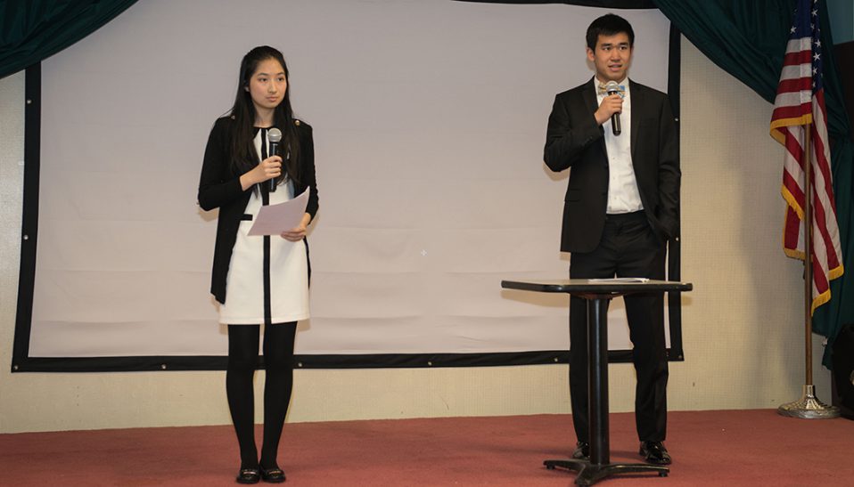 Tina Zhang and her Youth Art Bridge Teammate address the audience at their fundraiser for cancer research