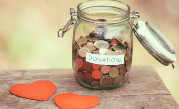Glass,Money,Jar,With,A,Label,With,The,Word,Donations Glass,Money,Jar,With,A,Label,With,The,Word,Donations