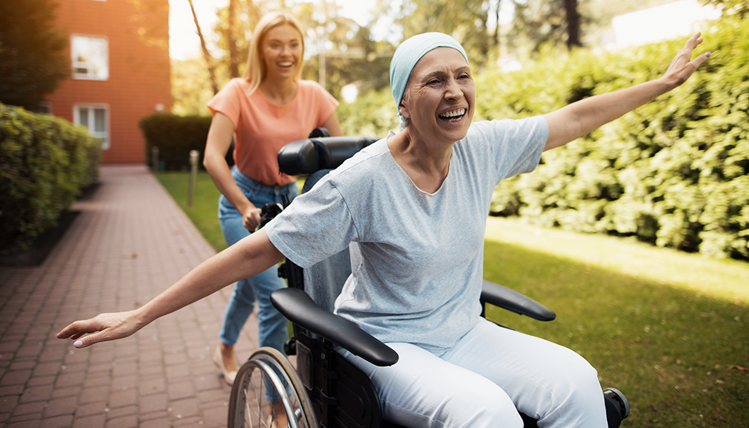 A,Woman,With,Cancer,Is,Sitting,In,A,Wheelchair.,She