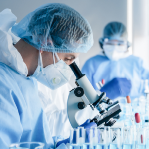 Research Programs Researcher with microscope